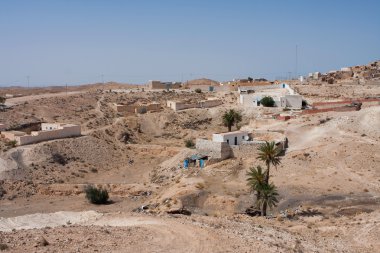 Troglodytic village in the Sahara desert clipart