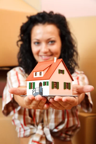 Woman with miniature house — Stock Photo, Image