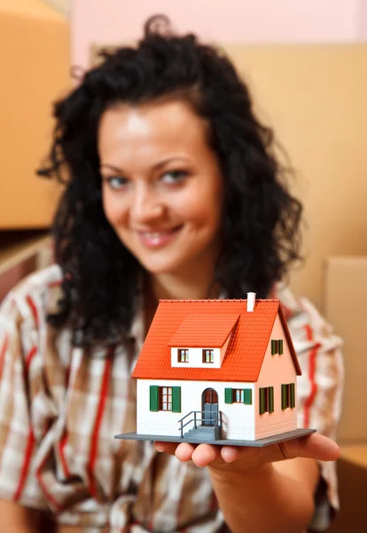 Woman with miniature house — Stock Photo, Image