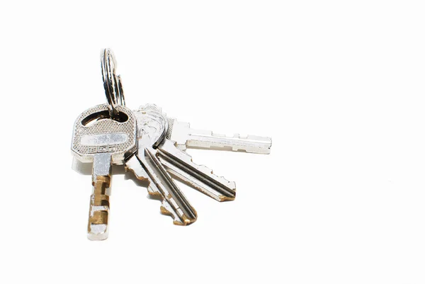 Zilveren sleutelhanger bundel geïsoleerd — Stockfoto
