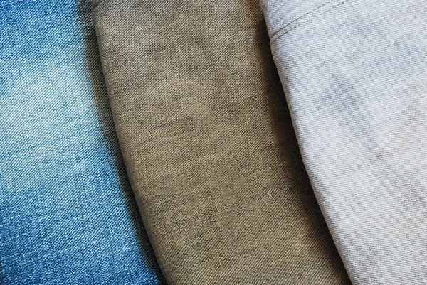 Tres colores jeans pila textura fondo imagen — Foto de Stock
