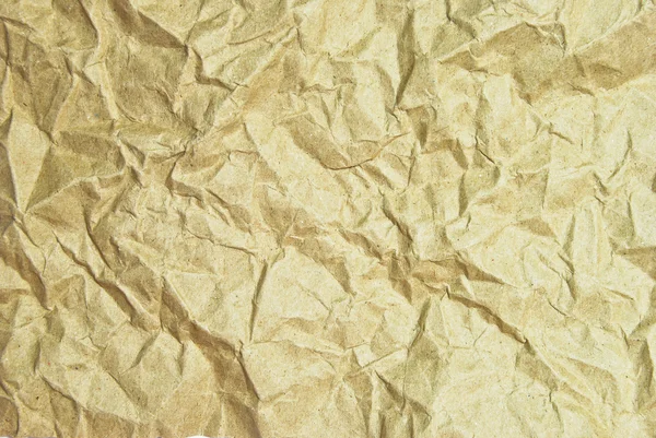 Bruin verfrommeld papier achtergrond textuur — Stockfoto