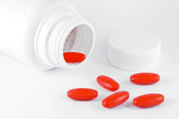 Frasco de vitamina c y tabletas de medicamentos aislados —  Fotos de Stock