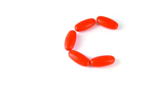 C letter aligned vitamin medicine tablets isolated — Stock Photo, Image