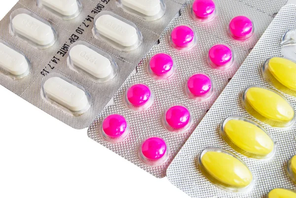 Pacote de comprimidos de medicina colorida fundo — Fotografia de Stock