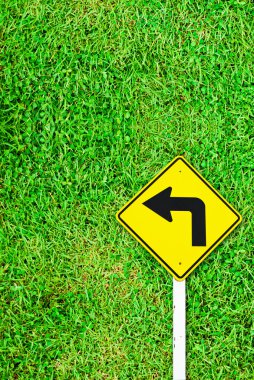 Turn right traffic sign on grass field clipart