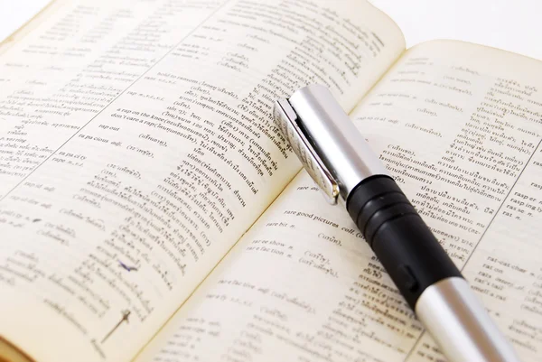 Closeup of old dictionary pen — Stock Photo, Image