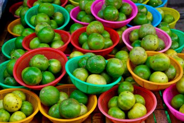 Fresh limes in market clipart