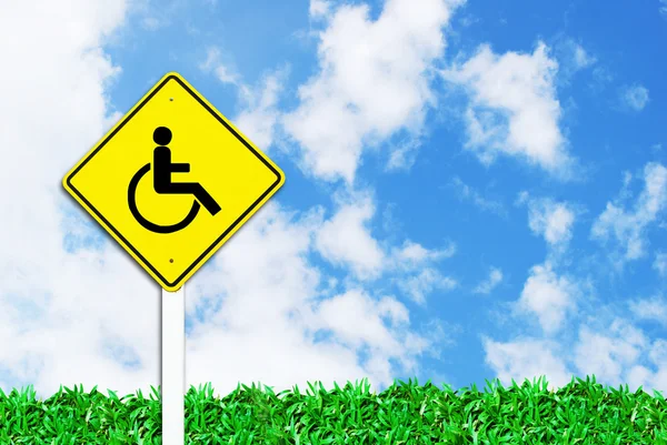 stock image Handicapped disabled sign on beautiful sky and grass field background