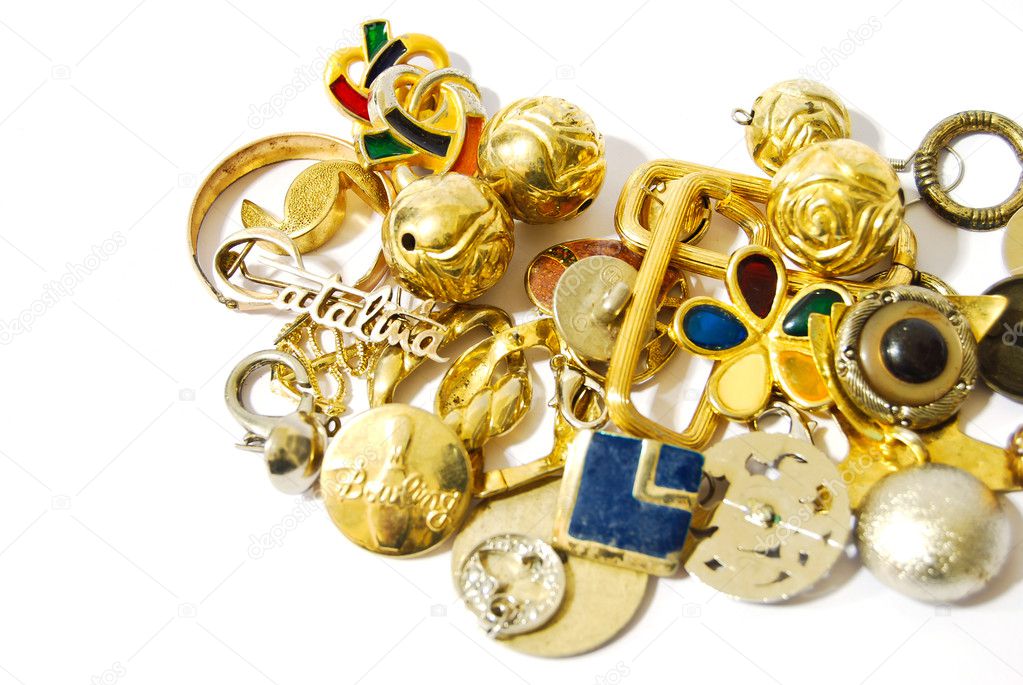 Golden silver accessories and jewelry closeup isolated