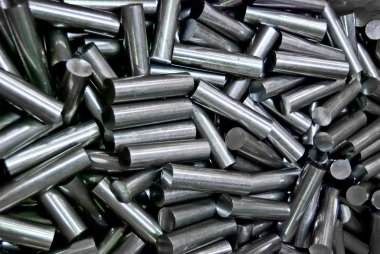 Pile of metal pipes in factory , the waste from process , closeup background clipart