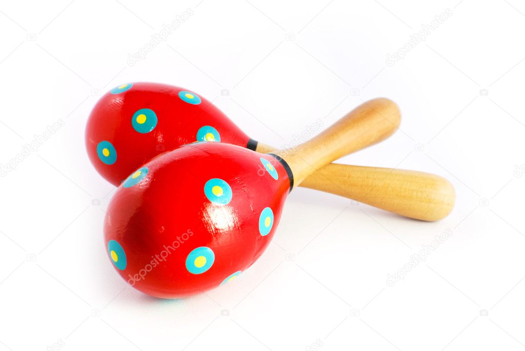 Colorful wooden toy maracas music percussion instrument isolated on white background