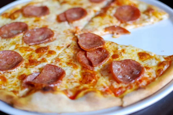 stock image Pepperoni pizza on white dish , served hot , closeup view , original from italian restaurant