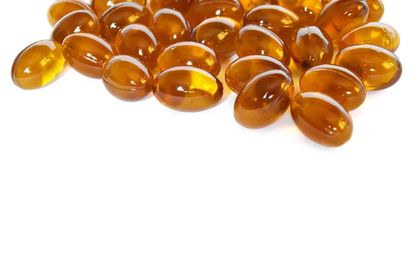 Pílulas de cápsula de gel de óleo de peixe marrom close-up — Fotografia de Stock