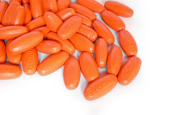 Comprimidos de vitaminas laranja closeup — Fotografia de Stock