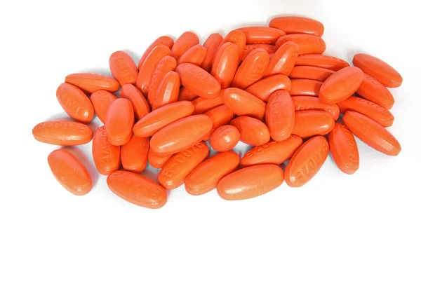 stock image Orange vitamin medicine pills closeup