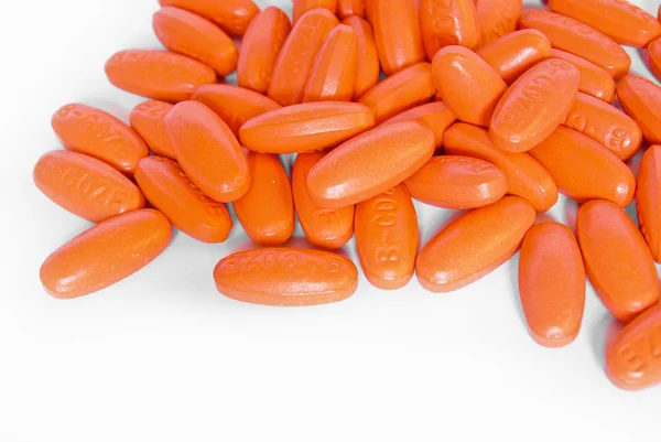 Pomarańczowy witaminy medycyna pigułki zbliżenie — Zdjęcie stockowe