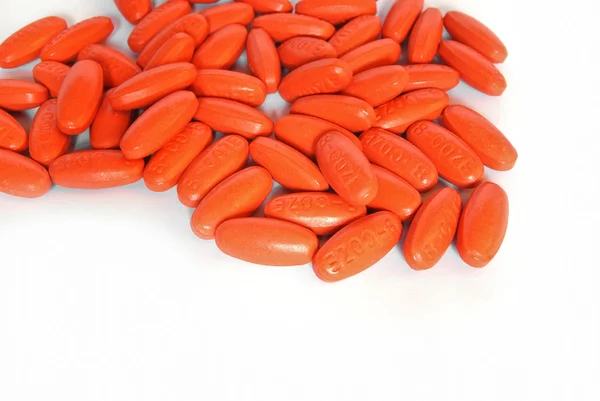 Orange vitamin medicine pills closeup — Stock Photo, Image