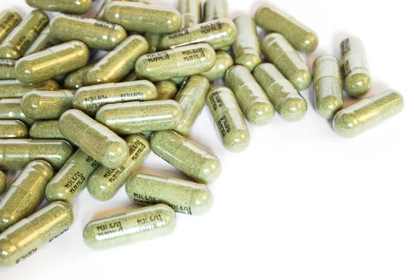 Capsula verde di erbe medicinali — Foto Stock