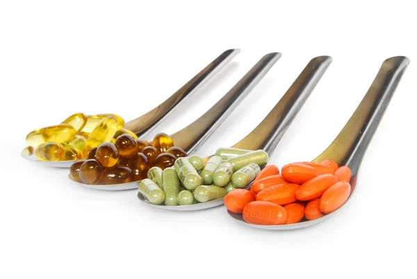 Lžíce s vitaminy medicína barevné — Stock fotografie