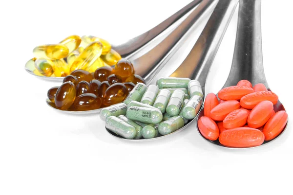 Lžíce s vitaminy medicína barevné — Stock fotografie