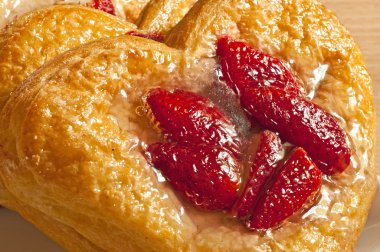 Flaky pastry heart with strawberries clipart