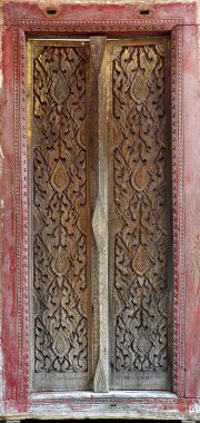 Carved wooden doors over 120 years old. clipart