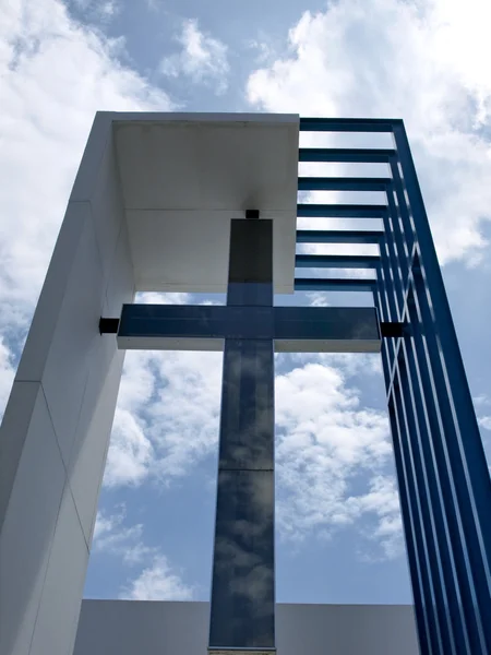 stock image Contemporary cross against the sky