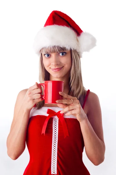 Mikołajowa dziewczyna trzyma kubek, pij. Święta Bożego Narodzenia i Nowy Rok — Zdjęcie stockowe