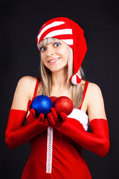 Santa girl holding a Christmas ball, Christmas toys.Holidays Christmas And — Stock Photo, Image
