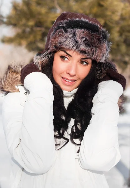 stock image A young beautiful girl on a walk in a winter park, winter, snow