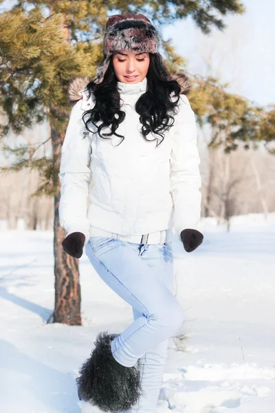 stock image A young beautiful girl on a walk in a winter park, winter, snow,