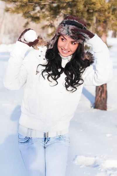 stock image A young beautiful girl on a walk in a winter park, winter, snow,