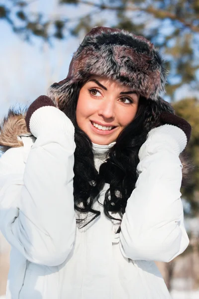 Stock image A young beautiful girl on a walk in a winter park, winter, snow