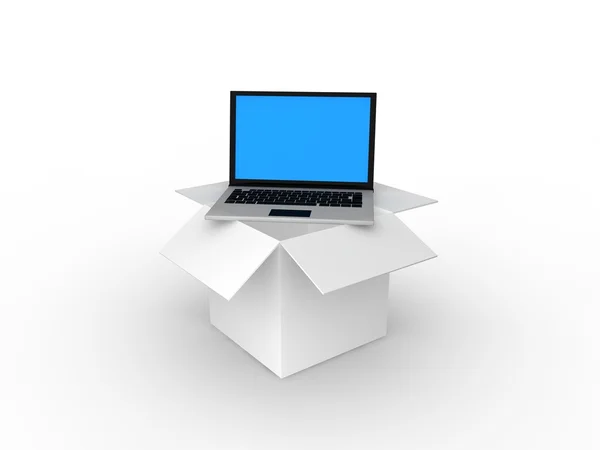 Laptop em caixa de papelão — Fotografia de Stock