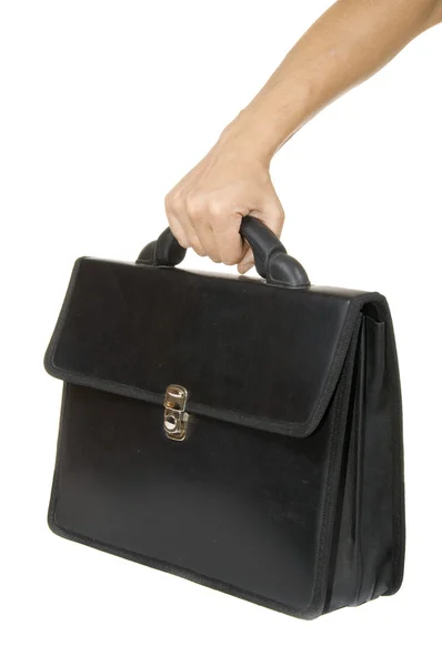 Mano sosteniendo un maletín negro — Foto de Stock