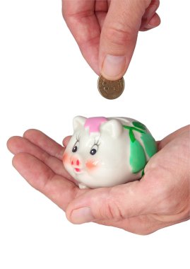 Deposits coin in piggy bank clipart