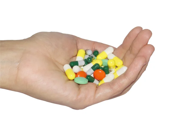 Tabletter i en hand — Stockfoto