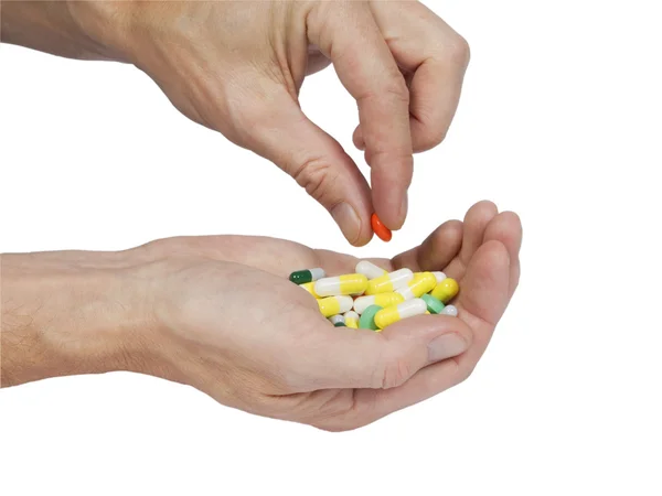 Tabletter i en hand — Stockfoto