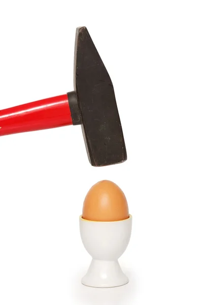 Egg cracking with hammer — Stock Photo, Image