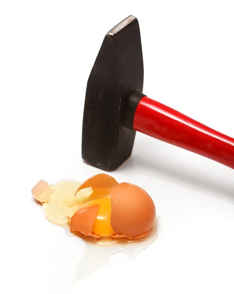 Egg cracked with hammer — Stock Photo, Image
