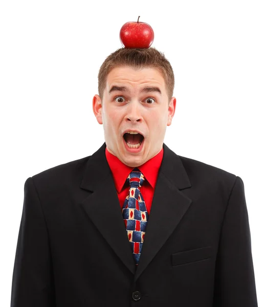 Homem de negócios assustado com maçã na cabeça — Fotografia de Stock