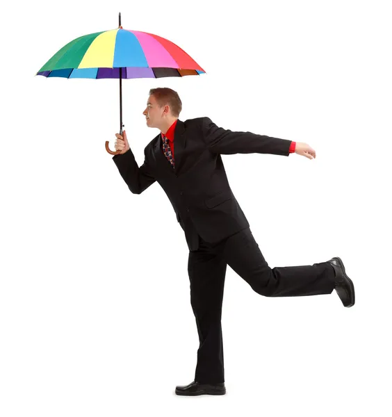 Чоловік з барвистою парасолькою — стокове фото