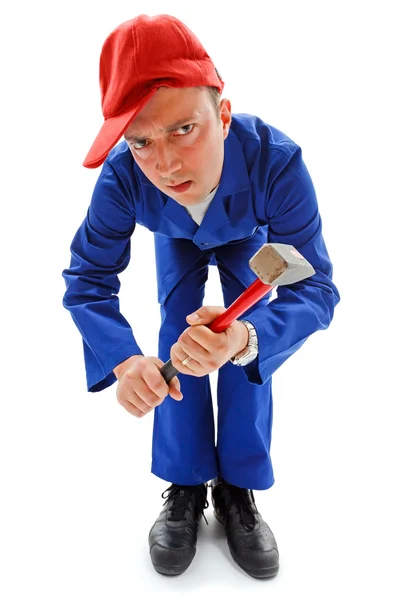 Awkward repairman with hammer — Stock Photo, Image