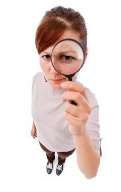 Serious woman as detective with magnifier clipart