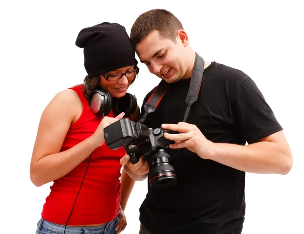 Photographer and model looking at photos — Stock Photo, Image