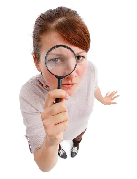 Serious woman as detective with magnifier — Stock Photo, Image