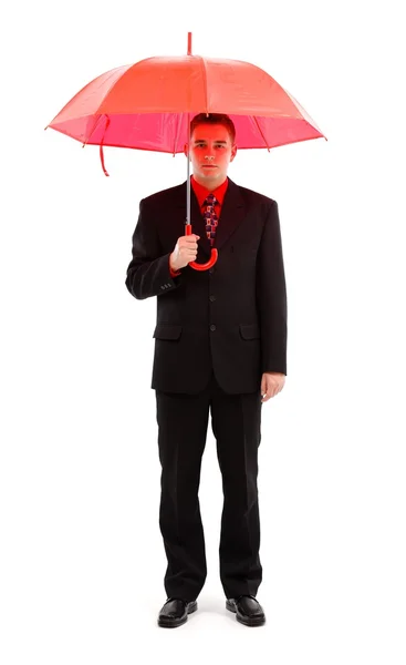 Geschäftsmann mit rotem Regenschirm — Stockfoto