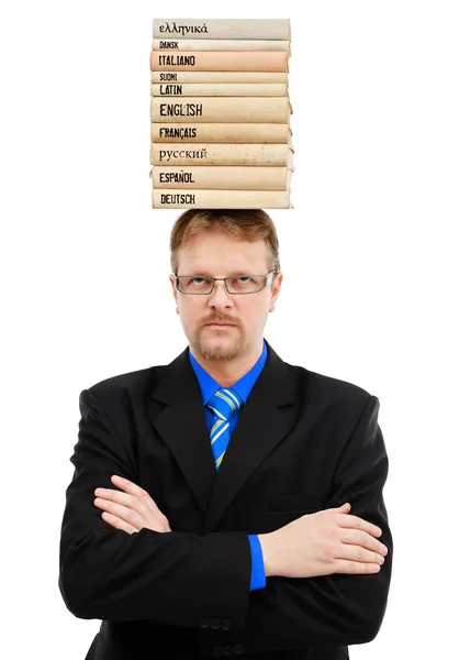 Homem com livros de idiomas na cabeça — Fotografia de Stock