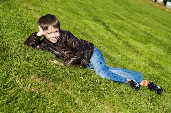 stock image Little boy Lying Down on the grass